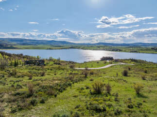 Luxury lakefront property with stunning mountain views.