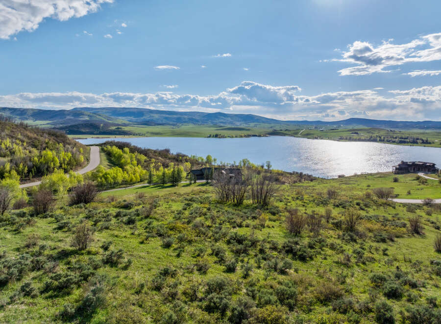 Luxury lakefront property with stunning mountain views.