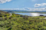 Luxury lakefront property with stunning mountain views.