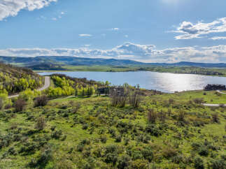 Luxury lakefront property with stunning mountain views.