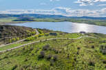 Luxury lakefront property with stunning mountain views and private road access.