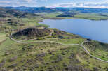 Luxury lakefront property with stunning mountain views and private road access.