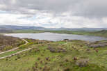 Luxury lakefront property with stunning mountain views and a private road.