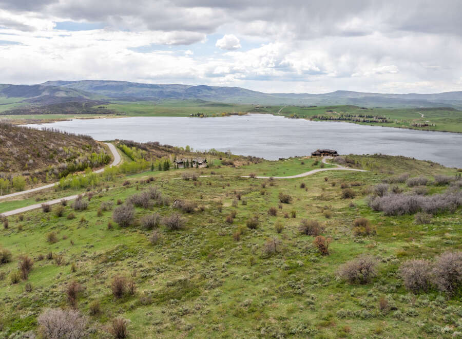Luxury lakefront property with stunning mountain views.