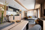 This stunning apartment boasts an open-plan living area with a modern kitchen, perfect for entertaining.