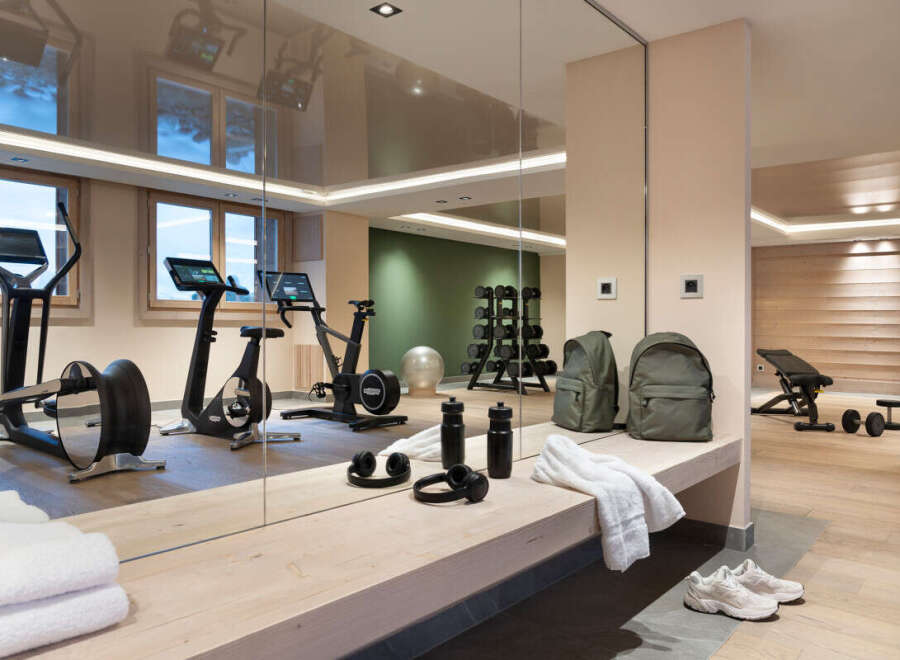 This stunning gym boasts state-of-the-art equipment, including stationary bikes and elliptical trainers, perfect for a challenging workout.
