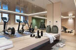 This stunning gym boasts state-of-the-art equipment, including stationary bikes and elliptical trainers, perfect for a challenging workout.