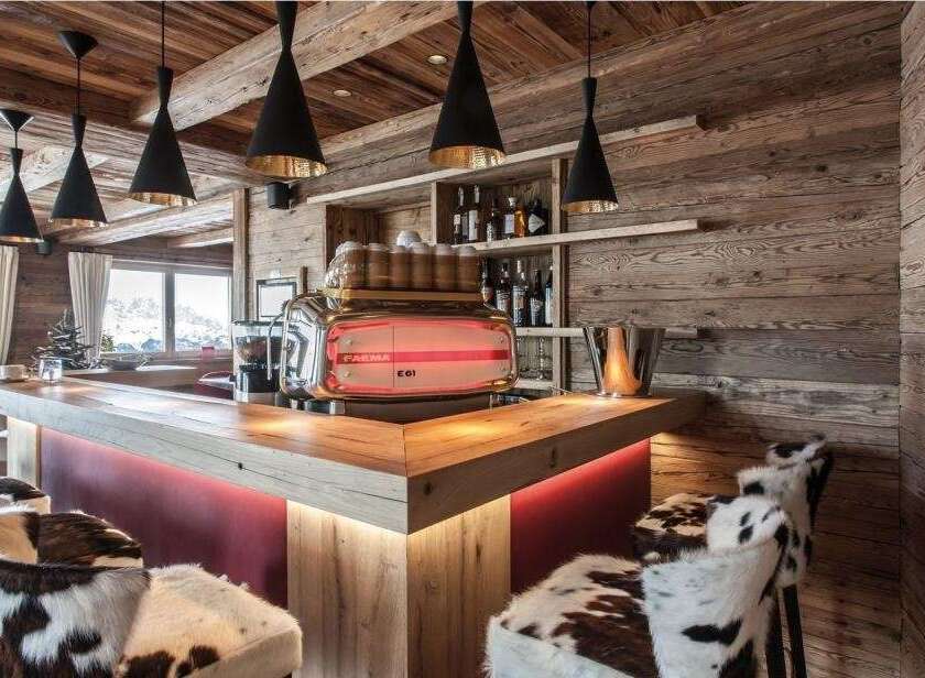 Experience luxury in this stunning property, featuring a beautifully designed bar area.