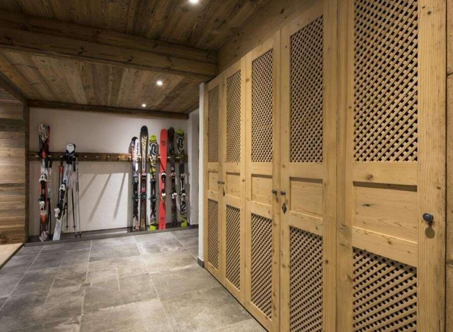 This stunning property boasts a ski storage room, perfect for winter enthusiasts.
