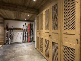 This stunning property boasts a ski storage room, perfect for winter enthusiasts.