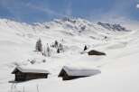 Experience the serene beauty of a snow-covered mountain landscape.