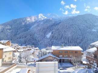 Nestled in a charming snow-covered village, this stunning property offers breathtaking views of the majestic French Alps.