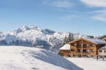 Experience the ultimate alpine retreat in this stunning chalet nestled amidst snow-capped mountains.