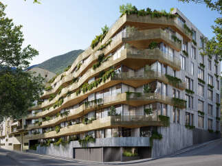 Discover luxury living in this stunning eco-friendly apartment building, nestled in a mountainside setting.