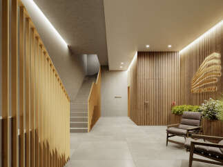 This stunning property boasts a modern and elegant design, featuring a sleek staircase with gold accents and a calming lobby area with comfortable seating.