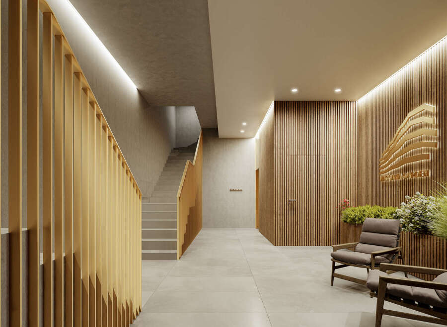 This stunning property boasts a modern and elegant design, featuring a sleek staircase with gold accents and a calming lobby area with comfortable seating.