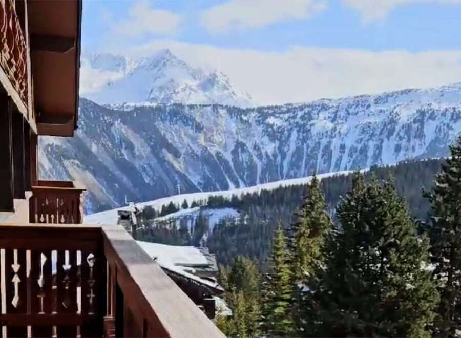 Breathtaking mountain views from this stunning chalet balcony.