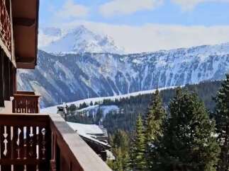 Breathtaking mountain views from this stunning chalet balcony.
