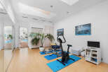 This stunning home boasts a luxurious indoor gym, complete with state-of-the-art equipment and a tranquil atmosphere.