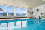 Indoor pool with stunning mountain views.