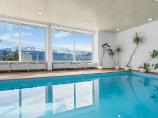 Indoor pool with stunning mountain views.