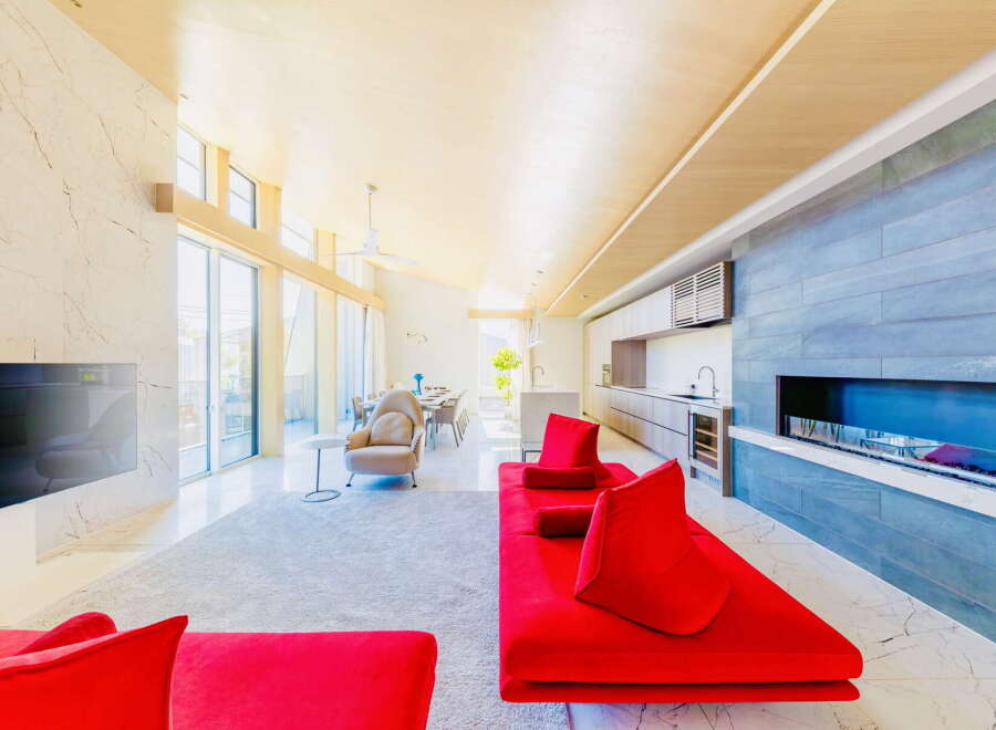 Stunning open-plan living space with floor-to-ceiling windows offering abundant natural light.