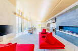 Stunning open-plan living space with floor-to-ceiling windows offering abundant natural light.
