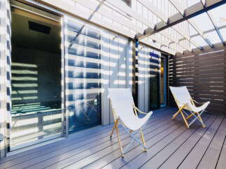 Relax and unwind on your private deck, complete with comfortable lounge chairs and stunning views.