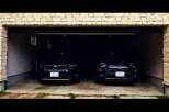 Park your cars in this spacious two-car garage, featuring a modern design and convenient storage.