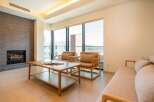 Modern living space with floor-to-ceiling windows offering stunning views.