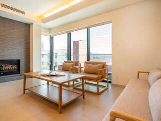 Modern living space with floor-to-ceiling windows offering stunning views.