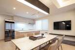 Modern kitchen with sleek appliances and ample counter space.