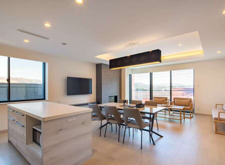This stunning property boasts an open-concept living space with floor-to-ceiling windows offering breathtaking views.