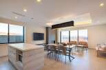This stunning property boasts an open-concept living space with floor-to-ceiling windows offering breathtaking views.