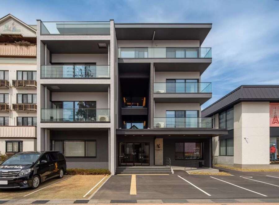 This stunning modern building boasts four floors of luxury apartments, each with its own private balcony.