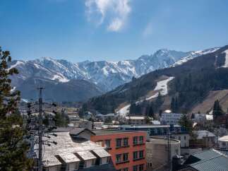 This stunning property boasts breathtaking views of the Japanese Alps, offering a serene escape in a vibrant mountain town.
