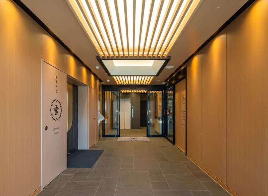 This stunning property boasts a sophisticated entrance with a sleek, modern design.
