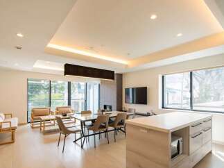 This stunning property boasts an open-concept living area with floor-to-ceiling windows offering abundant natural light and breathtaking views.