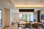 This stunning modern home boasts an open floor plan, seamlessly connecting the living and dining areas.