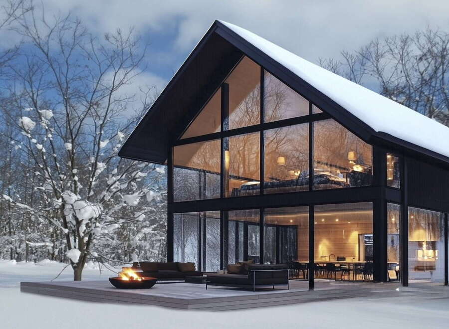 Stunning modern A-frame home nestled in a snowy winter wonderland.