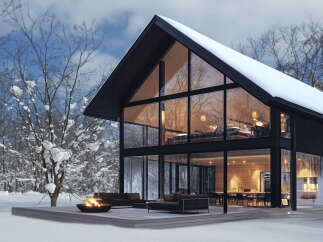 Stunning modern A-frame home nestled in a snowy winter wonderland.
