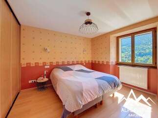 Cozy bedroom with mountain views and built-in closet.
