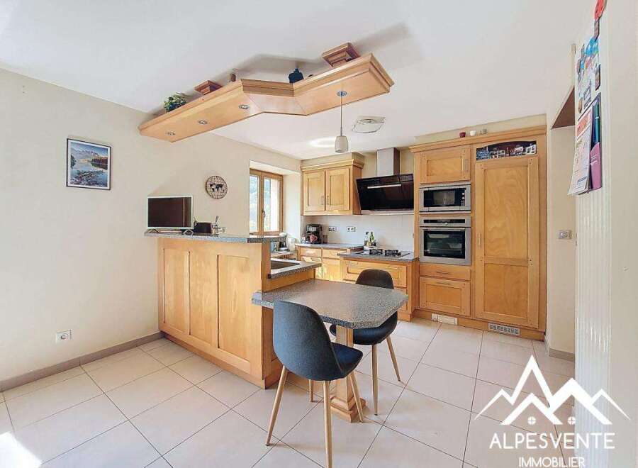 Bright and airy kitchen with ample cabinetry and a breakfast bar.