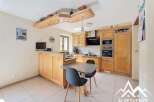 Bright and airy kitchen with ample cabinetry and a breakfast bar.