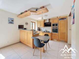 Bright and airy kitchen with ample cabinetry and a breakfast bar.