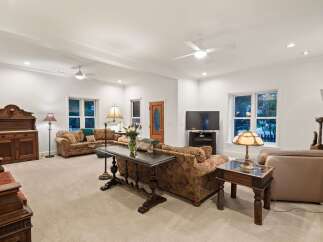 This stunning living room boasts a spacious and open floor plan, perfect for entertaining.