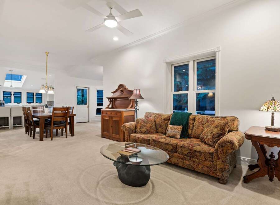 This stunning home boasts an open floor plan, seamlessly connecting the living room, dining area, and kitchen.