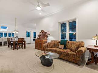 This stunning home boasts an open floor plan, seamlessly connecting the living room, dining area, and kitchen.