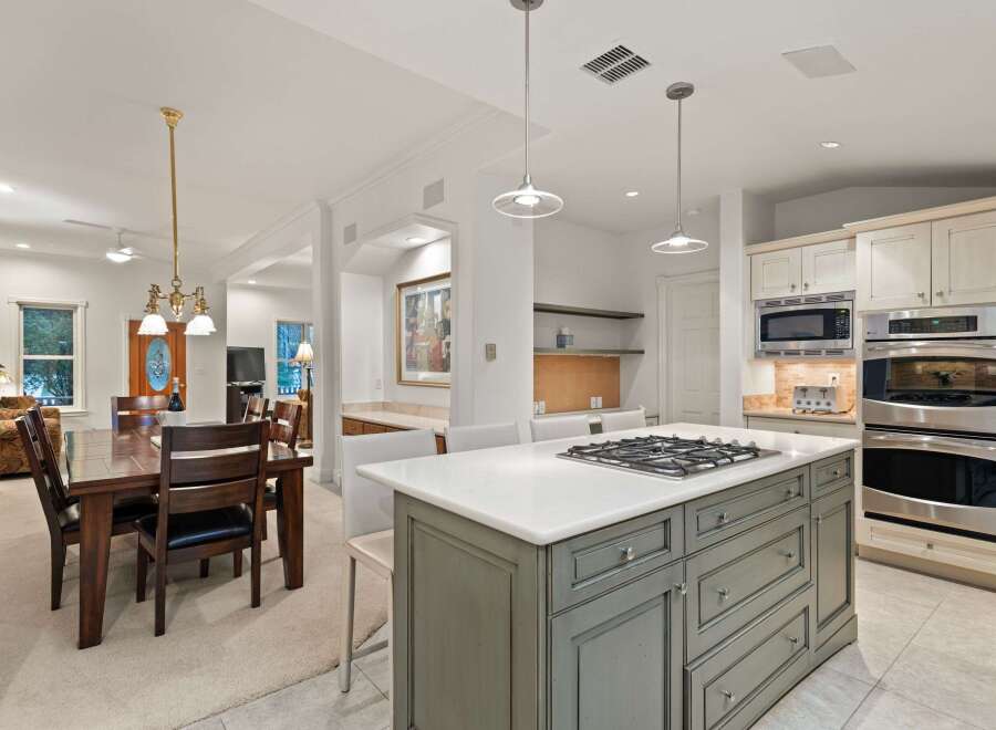 This stunning kitchen boasts a large island with a gas cooktop, perfect for entertaining.