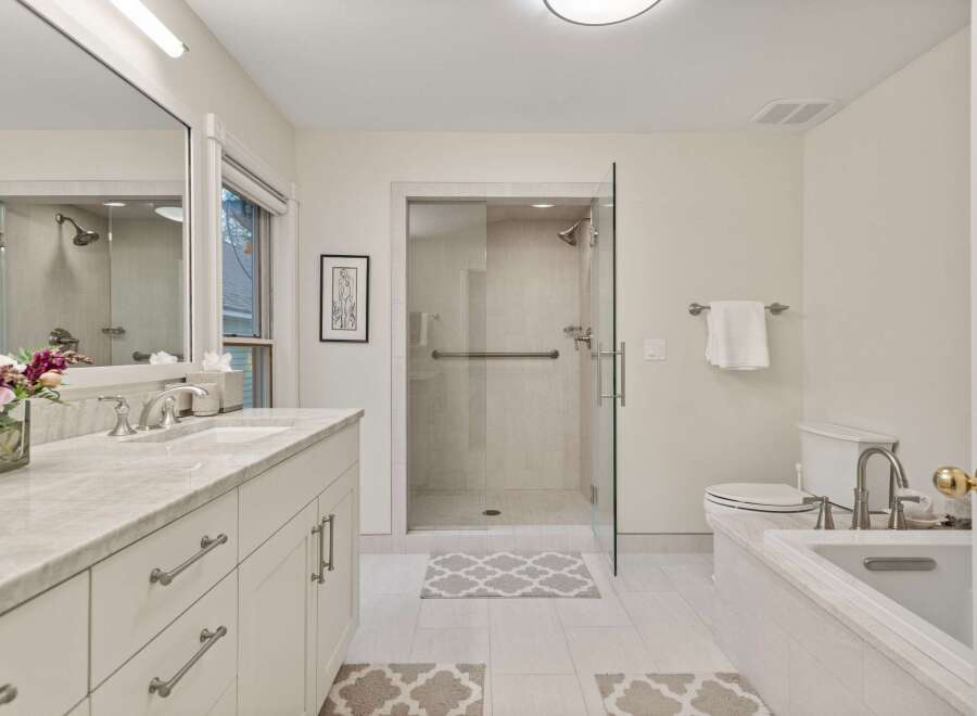 This stunning bathroom boasts a spacious layout with modern fixtures and finishes.